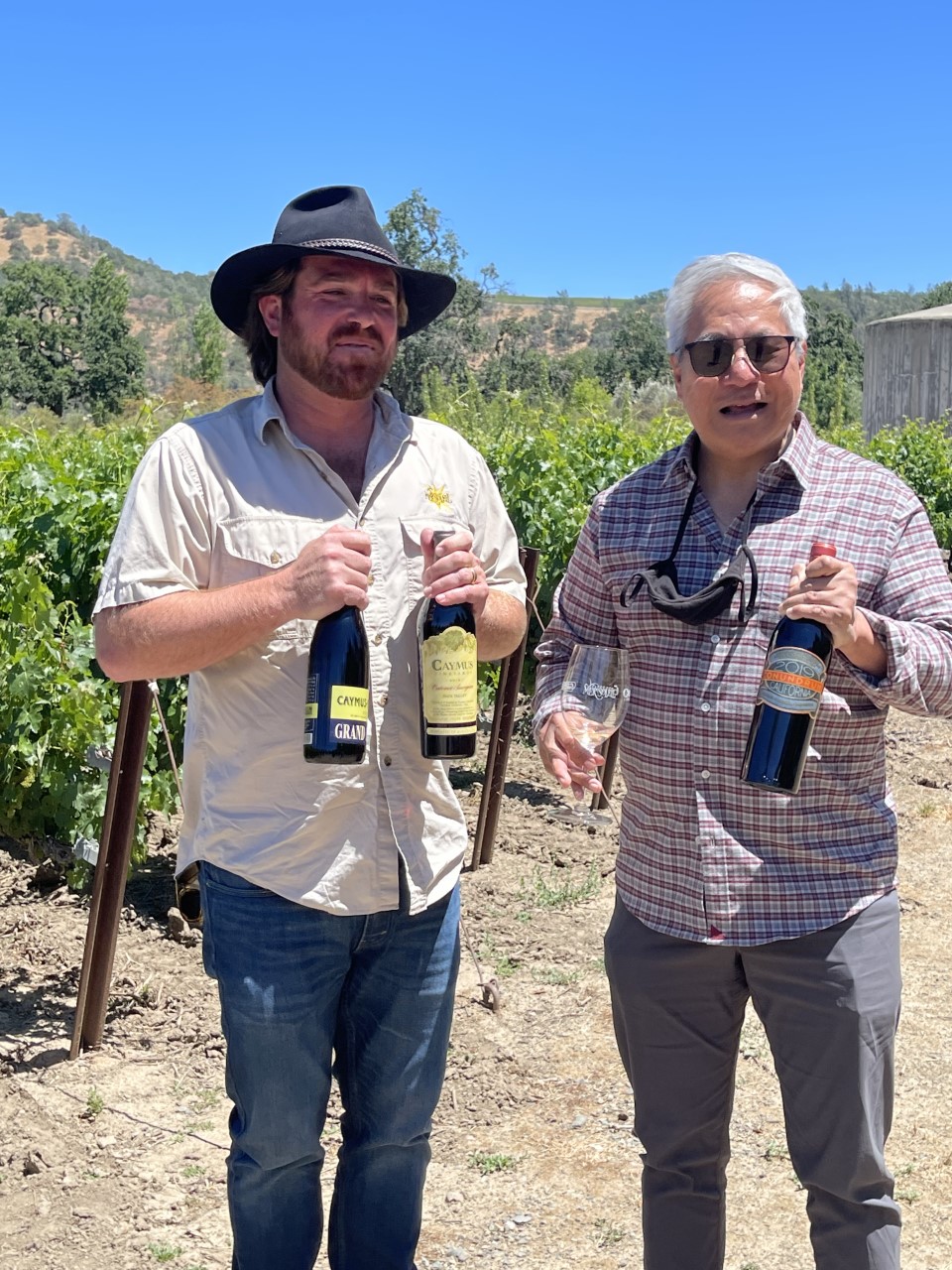 Two men holding Caymus Wines | The Wine Club Philippines